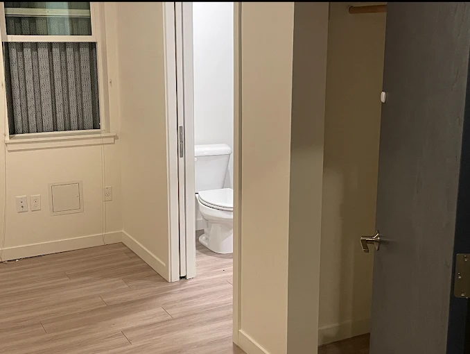 A clean bathroom and hallway